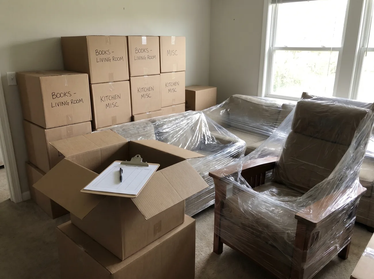 RescueHero technician photographing and inventorying belongings before a contents pack-out